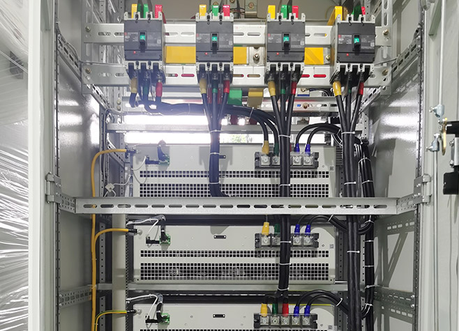 Internal wiring and rear view of an active harmonic filter cabinet system, showing integrated MCCBs and secure three-phase cable connections for APF modules.
