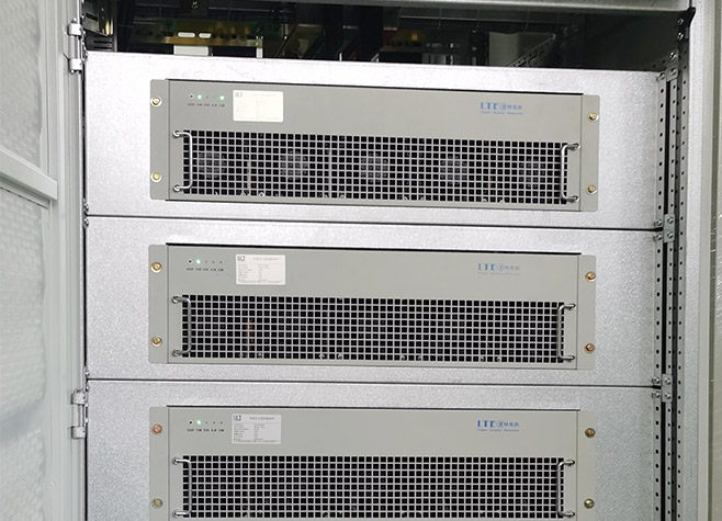 Vertical view of a modular active harmonic filter cabinet system integrating four APF modules and a top-mounted HMI touch screen display.