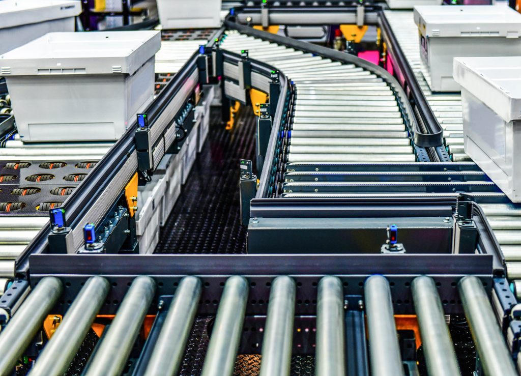Industrial sorting conveyor system with VFD motors requiring detuned reactors for harmonic mitigation