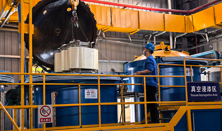 Industrial Vacuum Pressure Impregnation (VPI) equipment in operation for filter reactor Class H insulation processing.
