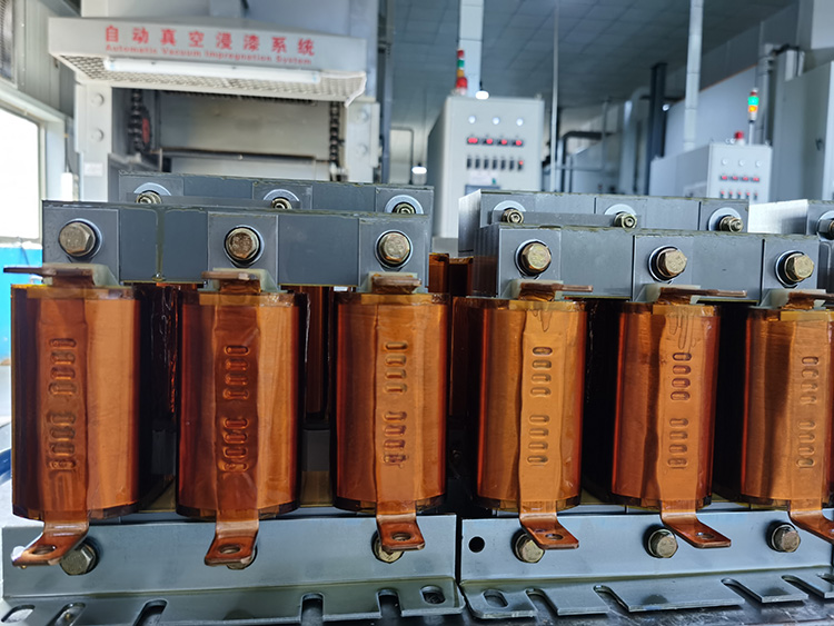 Industrial high-linearity detuned reactor undergoing VPI (Vacuum Pressure Impregnation) process in a manufacturing facility for enhanced reliability and harmonic control.