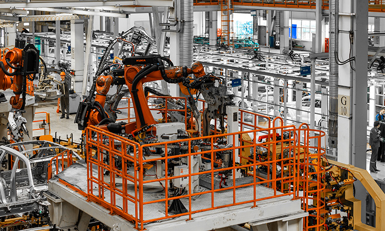 Modern automated manufacturing plant with robotic assembly lines suited for active harmonic filters