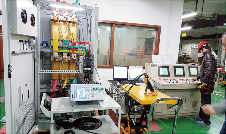 Engineer conducting diagnostic testing on an electrical control system in a factory setting by LTECPower
